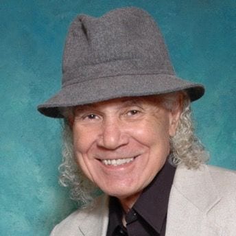 Elderly man with curly hair