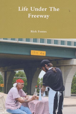 Two people dining under a freeway
